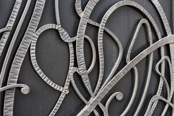 Elements of wrought iron fence in retro style