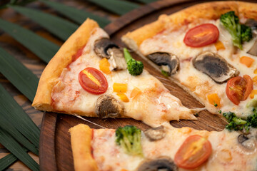 Juicy pizza with mushrooms and tomatoes. Traditional italian food, top view. Nutrition dinner or lunch. Horizontal format.