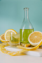 Classical limonchello in the glass and lemons