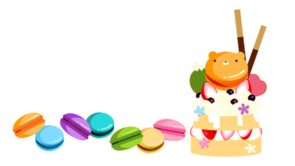 マカロンとクッキー・ポッキーでデコレーションしたイチゴケーキにお花をちりばめてみました