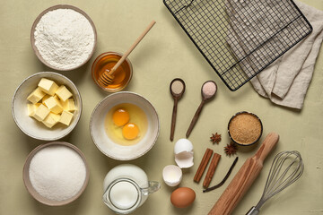 Table with baking ingredients. Plaster beige background. View from above.