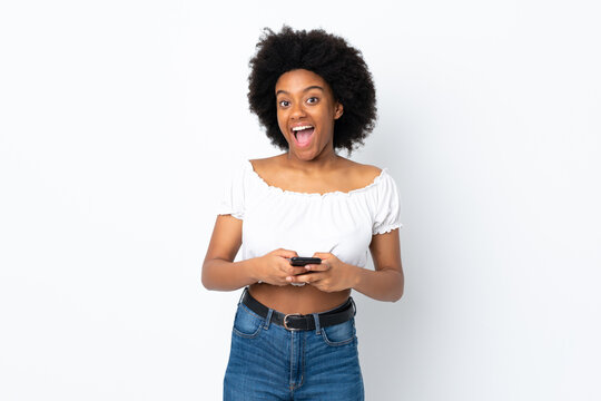 Young African American woman isolated on white background surprised and sending a message