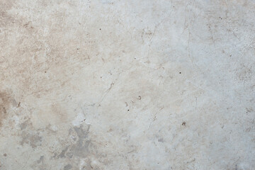 old and dirty cement background cracked by the passage of time.