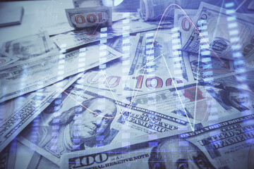 Multi exposure of forex chart drawing over us dollars bill background. Concept of financial success markets.