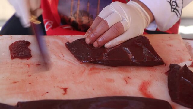 Video of cutting liver with knife. Turkish livers. Turkish ciger