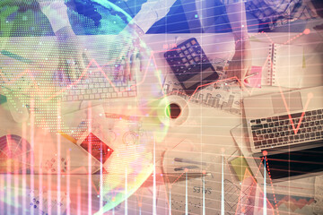 Obraz premium Double exposure of man and woman working together and financial chart hologram drawing. market analysis concept. Computer background. Top View.