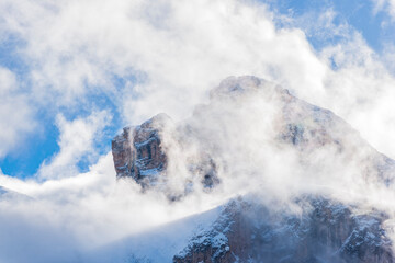 Dolomite Mountains covered with clouds in winter, view for the Brunecker Turm.