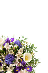 Border with purple and white spring flowers isolated on a white background. Beautiful floral composition. Vertical format. Copy space, top view, flat lay.
