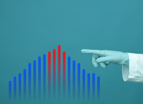 hand of a medic in a blue latex glove points to the graph, blue background