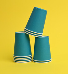 blue paper cup on a yellow background.