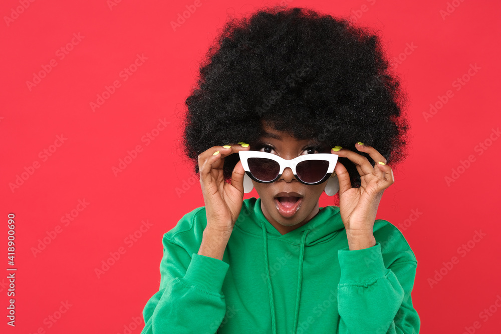 Sticker Crazy woman posing on red background.