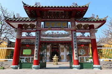 Hoi An, Vietnam, March 8, 2021: Colorful and decorated main entrance door of a Taoist Temple in Hoi An, Vietnam