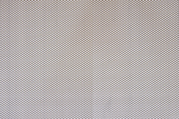 Abstract closeup of metallic background with colour background