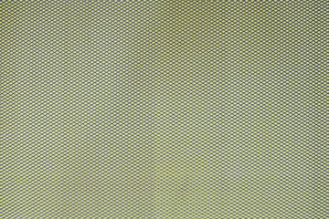 Abstract closeup of metallic background with colour background