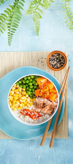Food banner Poke bowl flamed salmon, rice, pumkin, green peas, sweetcorn, sesame seeds. Turquise...