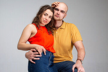 White young man and woman isolated on gray