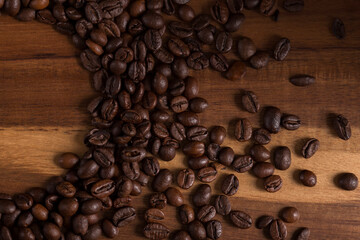Coffee beans on a wooden board.