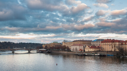 Fototapeta na wymiar View from the Charles bridge in Prague over the Vlatva river on cloudy day