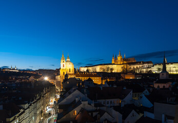 View from the Charles bridge tower in Prague to Prague Palace and cathedral at night
