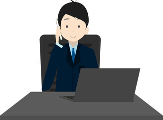 パソコンで作業しながら電話するビジネスマン