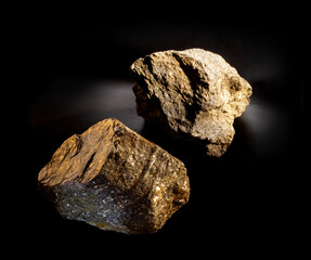 A couple of shiny muscovite mica mineral crystals isolated on black. Found in Ural, Russia. For geology mineralogy magazines or websites, stone collection catalog, Natural Science museum wall chart.