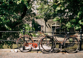 Fototapeta na wymiar Film photo of bikes on an old canal