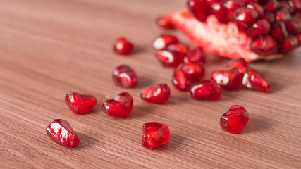 Juicy red sweet pomegranate kernels close up