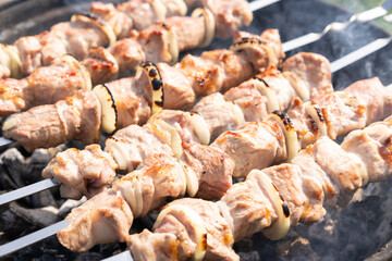 Step by step. Cooking pork shashlik on skewers on the grill. Step 2