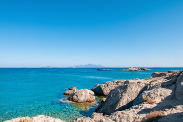 Landscape of beautiful bay with rocky beach in Kos island, Greece