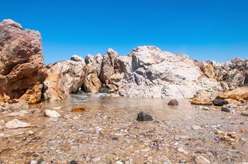 Fototapeta premium Landscape of beautiful bay with rocky beach in Kos island, Greece