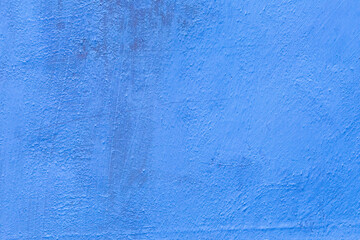 old cracked blue plaster wall