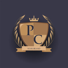initial letter PC logotype colored brown and gold isolated with shield, crown and laurel design, logo for college and sport club.