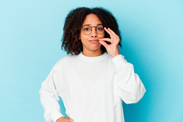 Young african american mixed race woman isolated afraid covering eyes with hands.