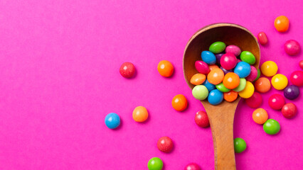 multicolored candy set with a wooden spoon