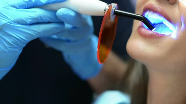 Dentist Using Ultraviolet Lamp