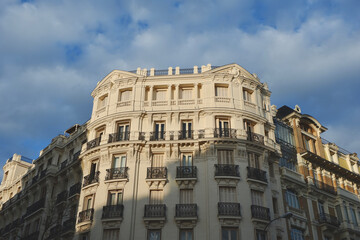 Obraz premium Corner of classy residential buildings in Chamberi district of Madrid, Spain. Set of rich classical houses on the street close to Retiro park.
