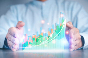 Businessman hand show Stock chart showing rising stock sign with graph indicator. Interest rate...