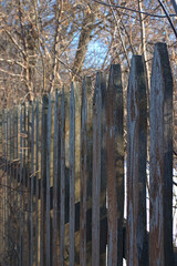 fragment of an old wooden picket fence