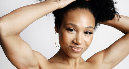 A young female model of Latin appearance poses. Perfect, Healthy, Clean, facial skin. Work in the...