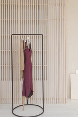 A dress stand with trendy dresses and wears at big room