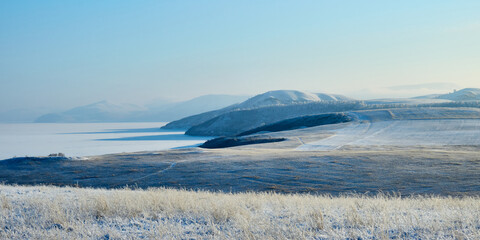 Obraz premium Winter sunny day near the banks of the Yenisei.