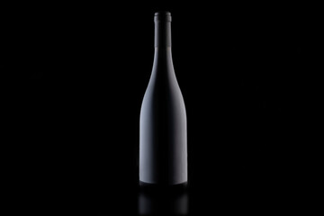 a bottle of wine on a black background, close-up . stylish mockup