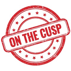 ON THE CUSP text on red grungy round rubber stamp.