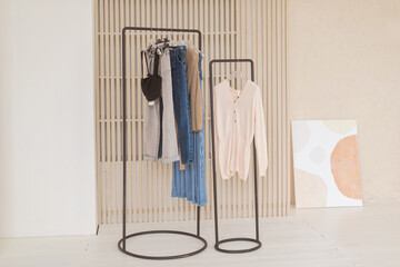 A dress stand with trendy dresses and wears at big room