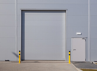 Gray roller shutter door - automatic metal roller door used in factory, storage