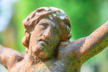 Conceptual image: сlose up portrait of Jesus Christ crown of thorns. Fragment of antique statue.