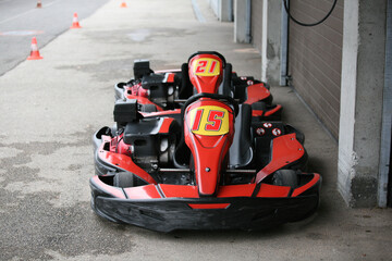 go-cart speeding along a race course . Motion blur in asphalt to emphasize speed.