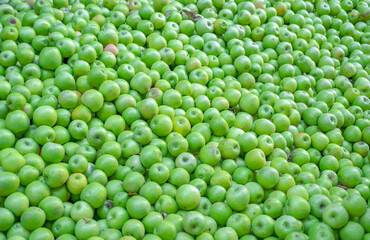 Background of raw natural bright green apples