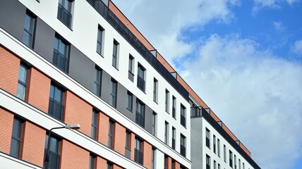 Cityscape with facade of a modern residential building. Modern European residential apartment building.