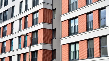 Cityscape with facade of a modern residential building. Modern European residential apartment building.